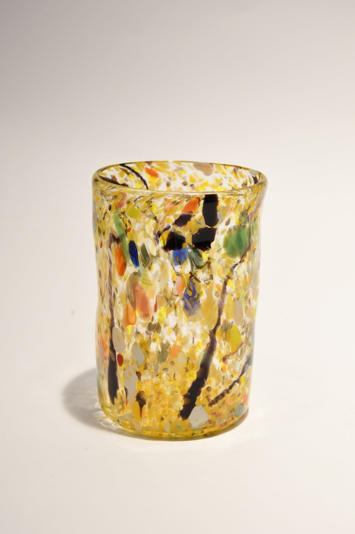 Murano glass tumbler with color spots and Aventurine