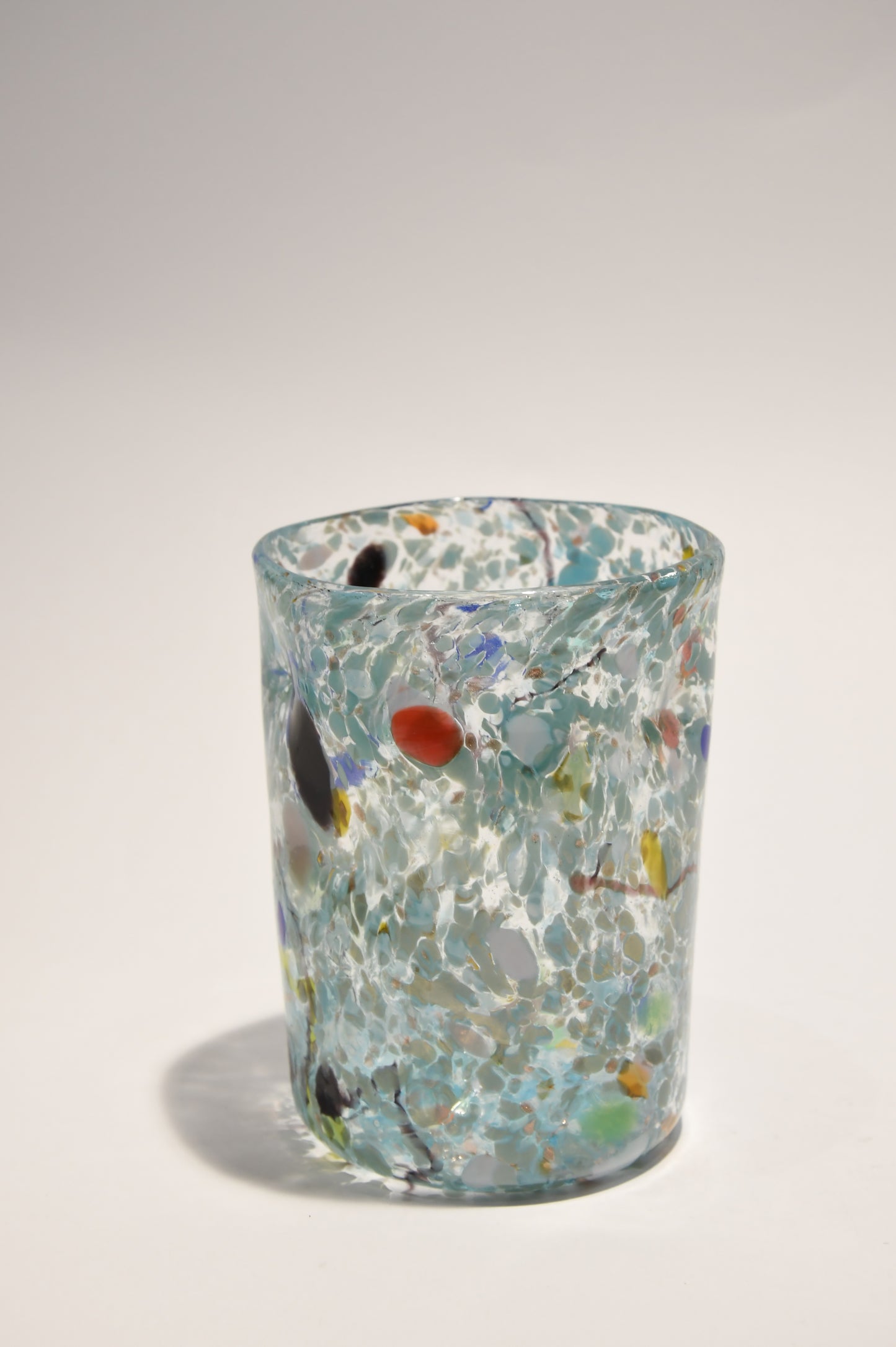 Murano glass tumbler with color spots and Aventurine