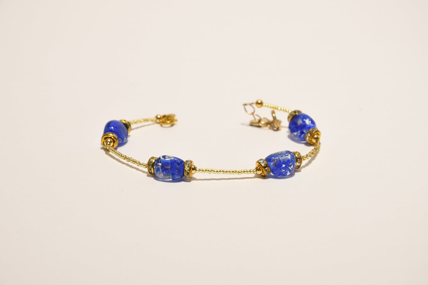 Golden bracelets with 4 pomegranate style beads in Murano glass