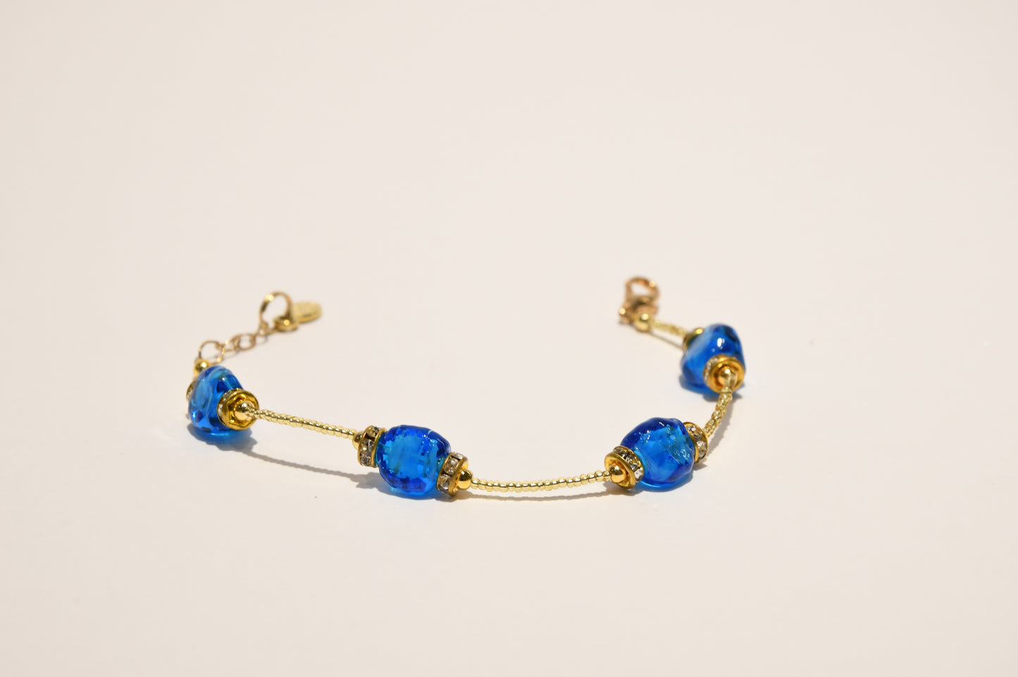 Golden bracelets with 4 pomegranate style beads in Murano glass