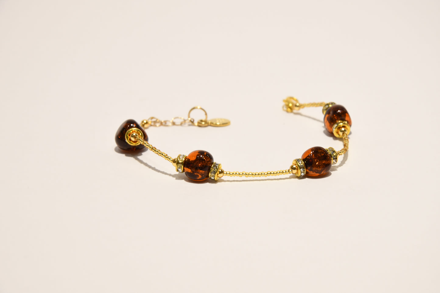 Golden bracelets with 4 pomegranate style beads in Murano glass