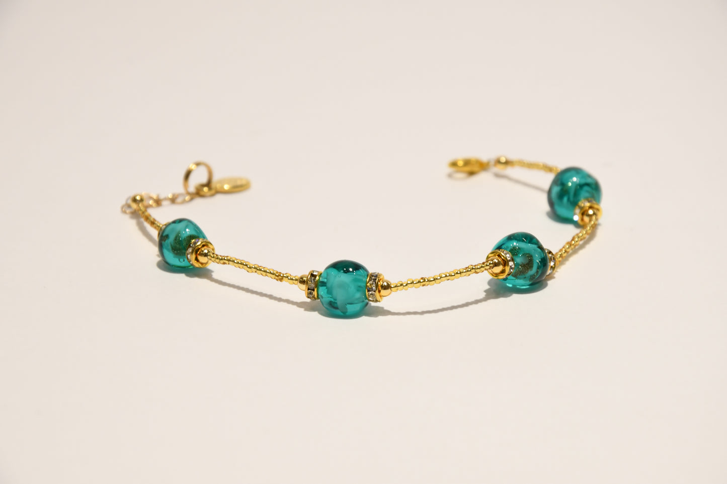 Golden bracelets with 4 pomegranate style beads in Murano glass