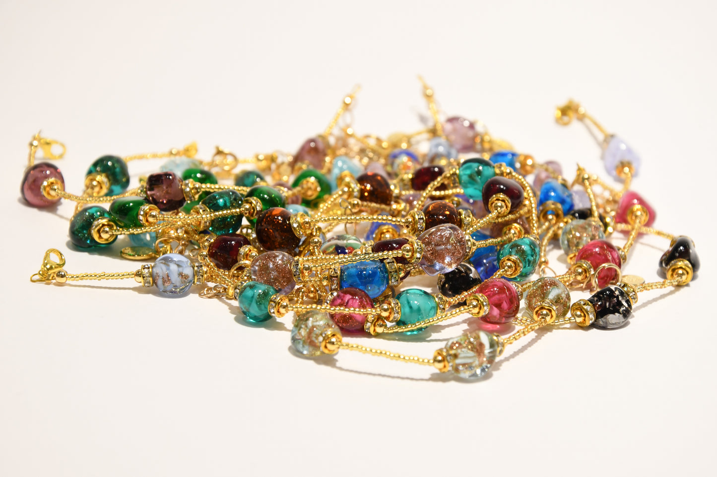 Golden bracelets with 4 pomegranate style beads in Murano glass